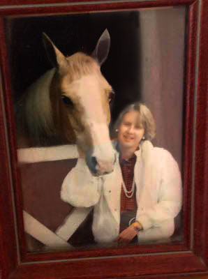 lady-with-blonde-horse-at-barn