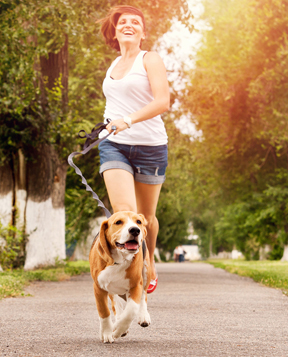 woman-running-with-dog-on-leash