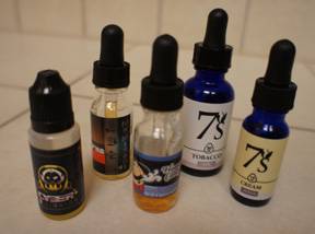 Photo of vials with liquid for e-cigarettes