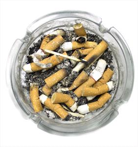 Photo of an ash tray filled with cigarette butts and ashes 