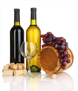Stock photo of wine bottles, wine glass, grapes and corks